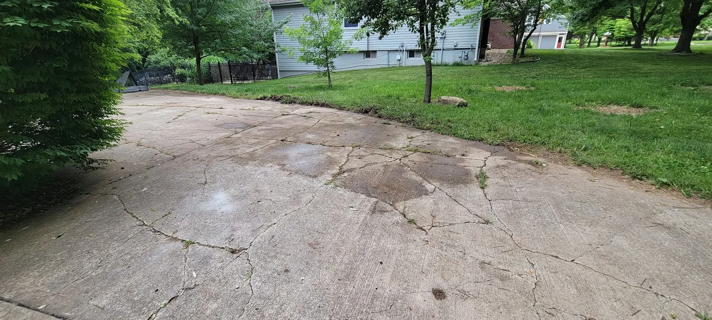 Close-up of a garage doorway gap before mudjacking repair